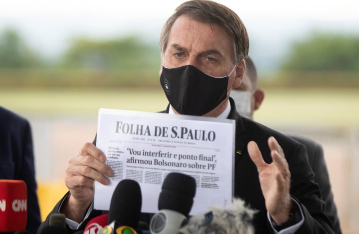 epa08424471 Brazilian President Jair Bolsonaro speaks to reporters at the entrance to the Palacio do Alvorada, in Brasilia, Brazil, 15 May 2020. Bolsonaro played down accusations of interference of the Federal Police corp, arguing he is protecting his family security. Bolsonaro also dealt with the resignation of health minister Nelson Teich on 15 May 2020 less than a month after Teich took the post amid the pandemic crisis in the country.  EPA/Joedson Alves