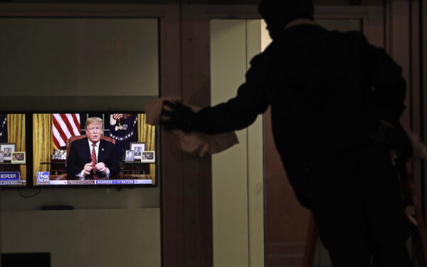 epa07270499 A maintenance worker cleans as US President Donald J. Trump addresses the nation on his immigration policy for the southern border, at the Fox News headquarters in midtown Manhattan in New York, New York, USA, 08 January 2019. The US government is in the eighteenth day of a partial shutdown over funding for President Trump's proposed border wall.  EPA/PETER FOLEY