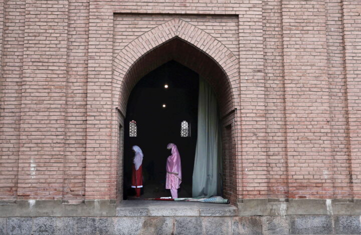 epa09400284 Kashmiri Muslim women offer Friday congregational  prayers at Jamia Masjid, the grand mosque of Srinagar, the summer capital of Indian Kashmir, 06 August 2021. The government allowed the reopening Jamia Masjid following their closure after the second wave of coronavirus but urged the people to wear masks and maintain social distancing norms.  EPA/FAROOQ KHAN
