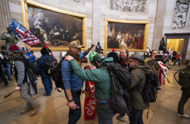 epa09664284 (13/24) (FILE) - Supporters of US President Trump in the Capitol Rotunda after breaching Capitol security in Washington, DC, USA, 06 January 2021 (reissued 03 January 2021). Following the November 2020 US presidential election, a tone set by supporters of defeated US President Donald Trump escalated further. Trump, who was refusing to concede the victory of Joe Biden, claiming voter fraud and rigged elections, told supporters and white nationalist extreme-right group Proud Boys to respectively 'Stop the Steal' and to 'stand back and stand by'. His social media accounts were suspended and the alt-right platform Parler gained in user numbers. 
 
On 06 January 2021, incumbent US vice president Pence was due to certify the Electoral College votes before Congress, the last step in the process before President-elect Biden was to be sworn in. In the morning, pro-Trump protesters had gathered for the so-called Save America March. Soon after Trump finished his speech at the Ellipse, the crowd marched to the Capitol. The attack had begun. 
 
Rioters broke into the Capitol building where the joint Congress session was being held. Lawmakers barricaded themselves inside the chambers and donned tear gas masks while rioters vandalized the building, some even occupying offices such as House Speaker Pelosi's. Eventually in the evening the building was cleared from insurrectionists, and the Congress chambers reconvened their session, confirming Joe Biden as the winner of the 2020 US presidential election. 

In the aftermath, more than 600 people were charged with federal crimes in connection to the insurgency, and close Trump aides such as Steve Bannon, Mark Meadows and Roger Stone were subpoenaed by the House select committee investigating the attack. Trump himself was acquitted by the Senate in his second impeachment trial, this time for 