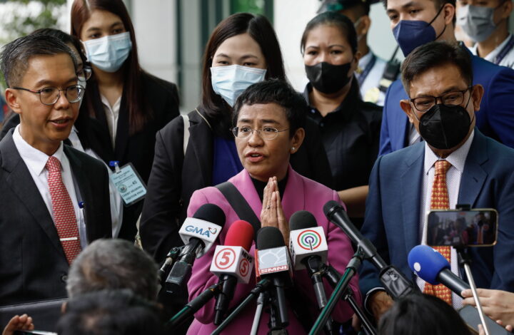 epa10412077 Nobel Peace Prize laureate Maria Ressa (C), the CEO of online news site Rappler, speaks to journalists outside the Court of Tax Appeals in Quezon City, Metro Manila, Philippines, 18 January 2023. The tax court acquitted Ressa and Rappler Holdings Corporation of four tax evasion charges that were filed in 2018 during the term of former Philippine president Rodrigo Duterte.  EPA/ROLEX DELA PENA