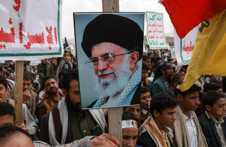 epa12232434 A Houthi supporter holds the portrait of Iran's supreme leader Ali Khamenei during a protest against the United States and Israel, amidst the ongoing military campaign in the Gaza Strip, in Sana'a, Yemen, 11 July 2025. Houthi leader Abdul-Malik al-Houthi vowed more attacks on Israel-linked shipping in the seas around Yemen until the conflict in the Gaza Strip is resolved. Yemen's Houthi rebels have claimed responsibility for the recent sinking of two cargo ships in the Red Sea.  EPA/YAHYA ARHAB